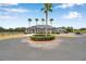 Lovely property featuring a circular driveway with mature palms and landscaping, adding a touch of elegance to the estate at 602 Swilley Rd, Plant City, FL 33567