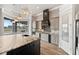 This amazing kitchen is equipped with custom lighting, gray cabinets, and a large island at 602 Swilley Rd, Plant City, FL 33567