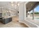 Open kitchen with island sink and view of outdoor patio at 602 Swilley Rd, Plant City, FL 33567