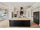Lovely kitchen features a large island, a walk-in pantry, and stainless steel appliances at 602 Swilley Rd, Plant City, FL 33567