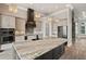 Bright kitchen with a large island, pendant lighting, and stainless steel appliances at 602 Swilley Rd, Plant City, FL 33567