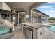 Outdoor kitchen and bar area with easy access to the home's interior at 602 Swilley Rd, Plant City, FL 33567