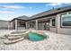 Stunning backyard pool with a stone waterfall feature and an outdoor kitchen, great for entertaining at 602 Swilley Rd, Plant City, FL 33567