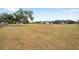 Wide open property with a house and large outbuilding on the lot at 602 Swilley Rd, Plant City, FL 33567
