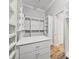 Spacious walk-in closet with custom shelving, drawers, and wood floor at 602 Swilley Rd, Plant City, FL 33567