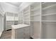 Spacious walk-in closet with custom shelving and center island at 602 Swilley Rd, Plant City, FL 33567