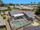 Aerial view of the home showcasing the screened-in pool, patio, and surrounding neighborhood at 6101 Willow Oak Cir, Bradenton, FL 34209