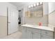 Well-lit bathroom with a vanity, medicine cabinet, and neutral tile at 6101 Willow Oak Cir, Bradenton, FL 34209