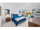 Inviting bedroom with a window seat, built-in bookcases, and a comfortable queen-sized bed at 6101 Willow Oak Cir, Bradenton, FL 34209