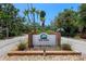 Community entrance sign, marked with brick and 'The Oaks' name at 6101 Willow Oak Cir, Bradenton, FL 34209
