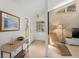 Bright foyer with wood accents, stylish decor, and a view into the spacious living area, creating a welcoming atmosphere at 6101 Willow Oak Cir, Bradenton, FL 34209