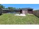 View of the private screened in pool in the backyard with a fenced in yard at 6101 Willow Oak Cir, Bradenton, FL 34209