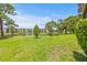 Serene backyard with a view of the pond and lush landscaping, creating a peaceful retreat at 6188 80Th N St # 101, St Petersburg, FL 33709