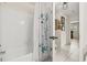 Well-lit bathroom featuring a white tile tub and a decorative shower curtain, offering a clean and inviting space at 6188 80Th N St # 101, St Petersburg, FL 33709