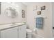 Bathroom featuring a single sink vanity, decorative mirror and towel rack with clean towels at 6188 80Th N St # 101, St Petersburg, FL 33709