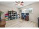 Versatile bedroom space, suitable for an office or guest room, with a window and ceiling fan at 6188 80Th N St # 101, St Petersburg, FL 33709