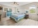 Serene bedroom with ample natural light, a decorative headboard, and charming furnishings at 6188 80Th N St # 101, St Petersburg, FL 33709