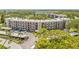 Aerial shot shows ample parking and manicured landscaping surrounding the building, highlighting its prime location at 6188 80Th N St # 101, St Petersburg, FL 33709