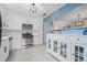 Bright updated kitchen with stainless steel appliances, white cabinets, and tile floors at 6188 80Th N St # 101, St Petersburg, FL 33709