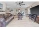 Spacious living room with hardwood floors, neutral paint, ceiling fan and comfortable seating at 6188 80Th N St # 101, St Petersburg, FL 33709