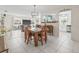Open concept living and dining area with tile floors and modern decor at 6188 80Th N St # 101, St Petersburg, FL 33709