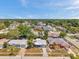 Aerial shot of a neighborhood showcasing well-maintained homes and lush landscaping at 6309 7Th Ave, New Port Richey, FL 34653