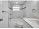 Bright bathroom featuring white marble tiles, modern fixtures, and a sleek, updated design at 6309 7Th Ave, New Port Richey, FL 34653