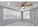 Bright bedroom with three large windows offering lots of natural light and views to the outside at 6309 7Th Ave, New Port Richey, FL 34653