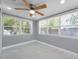 Bright bedroom with three large windows offering lots of natural light and views to the outside at 6309 7Th Ave, New Port Richey, FL 34653