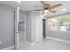 Bedroom featuring a closet with a sliding door and a ceiling fan for added comfort at 6309 7Th Ave, New Port Richey, FL 34653
