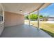 Covered front porch with decorative columns and a view of the well-maintained neighborhood at 6309 7Th Ave, New Port Richey, FL 34653