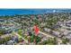 Aerial shot showcasing a residential area near a bridge over the water and a building on the horizon at 6490 22Nd S St, St Petersburg, FL 33712