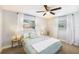 Serene bedroom with neutral decor, large windows, and a comfortable bed at 6490 22Nd S St, St Petersburg, FL 33712