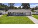 Charming single-story home with a well-manicured lawn and a neatly paved driveway at 6490 22Nd S St, St Petersburg, FL 33712