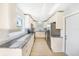 Bright kitchen featuring white cabinets, granite countertops, and stainless steel appliances at 6490 22Nd S St, St Petersburg, FL 33712