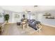 Comfortable living room featuring a sectional sofa, light wood floors, and decor at 6490 22Nd S St, St Petersburg, FL 33712