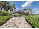 Welcoming Westbridge community sign amidst landscaping and stone pathway at 6563 Ryestone Way, Wesley Chapel, FL 33545