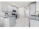 Well-equipped kitchen with gray cabinets, granite countertops, stainless steel appliances, and subway tile backsplash at 6563 Ryestone Way, Wesley Chapel, FL 33545