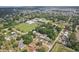 A wide aerial shot featuring the home in a neighborhood near schools and recreational areas at 707 9Th Sw Ave, Ruskin, FL 33570