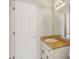 Bathroom features a white vanity with light countertops and a large mirror at 707 9Th Sw Ave, Ruskin, FL 33570