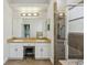 Bathroom showcasing double sinks, ample counter space, and a glass shower at 707 9Th Sw Ave, Ruskin, FL 33570