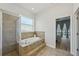 Bathroom with walk-in shower and soaking tub at 707 9Th Sw Ave, Ruskin, FL 33570
