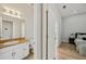 Bright bathroom with sink and access to the bedroom at 707 9Th Sw Ave, Ruskin, FL 33570