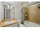 Neutral bathroom with shower-tub combo and tile surround at 707 9Th Sw Ave, Ruskin, FL 33570