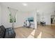 Well lit room with a comfortable couch provides a nice view and relaxing experience at 707 9Th Sw Ave, Ruskin, FL 33570