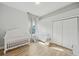 A Bedroom featuring wood floors, a white crib, and a white dresser at 707 9Th Sw Ave, Ruskin, FL 33570