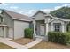 Inviting home exterior featuring a landscaped front yard and a covered entryway at 707 9Th Sw Ave, Ruskin, FL 33570