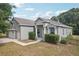 Charming single-Gathering home with a well-manicured lawn, two-car garage, and classic architectural details at 707 9Th Sw Ave, Ruskin, FL 33570