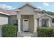 Welcoming front entrance with classic columns and manicured landscaping, exuding curb appeal at 707 9Th Sw Ave, Ruskin, FL 33570