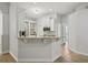 Open kitchen with granite countertops, stainless steel appliances, and breakfast bar with seating at 707 9Th Sw Ave, Ruskin, FL 33570